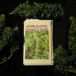 Grower's Guide book surrounded by buds